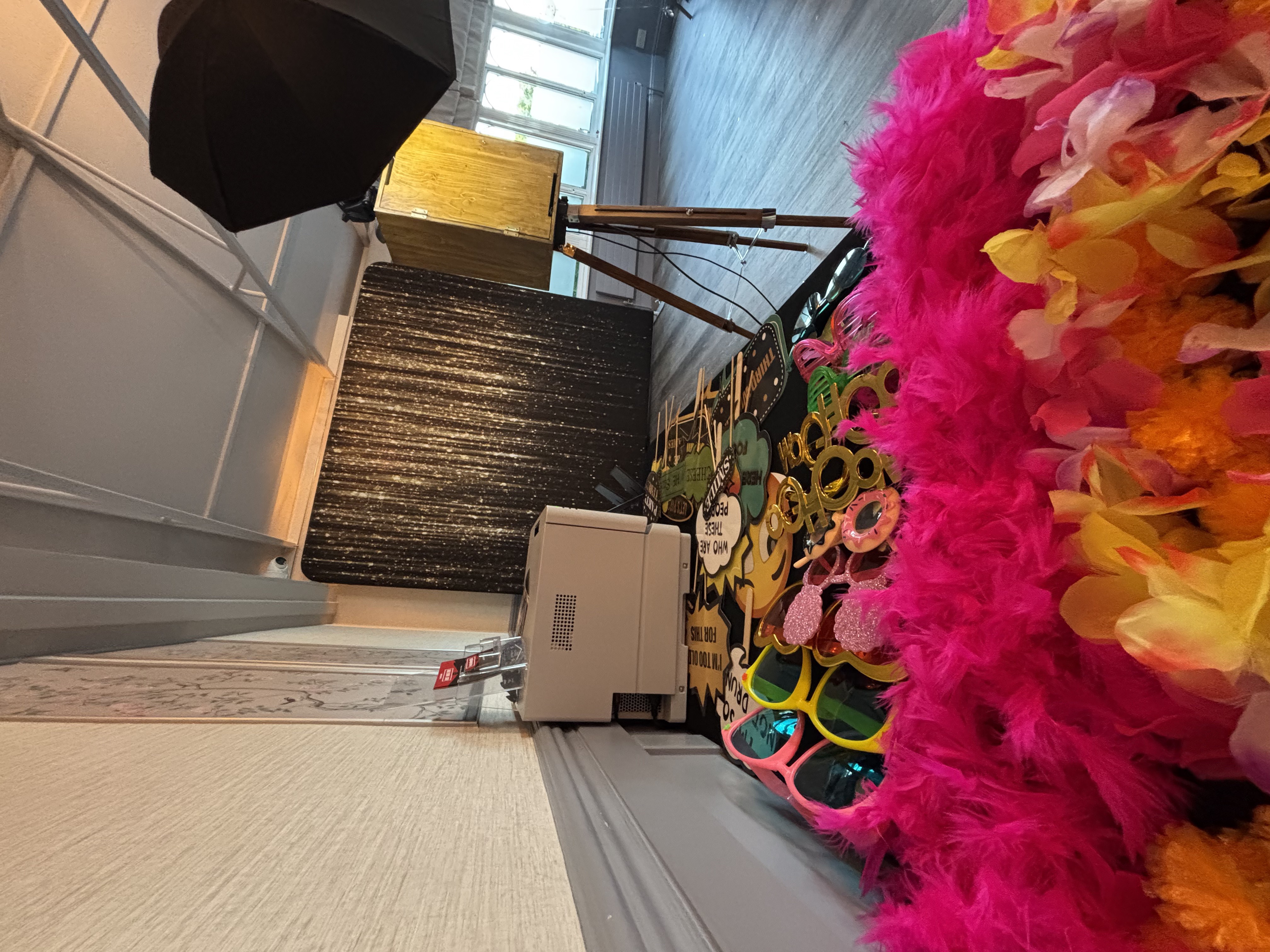 Glam Vintage booth with props display and instant printer at a wedding