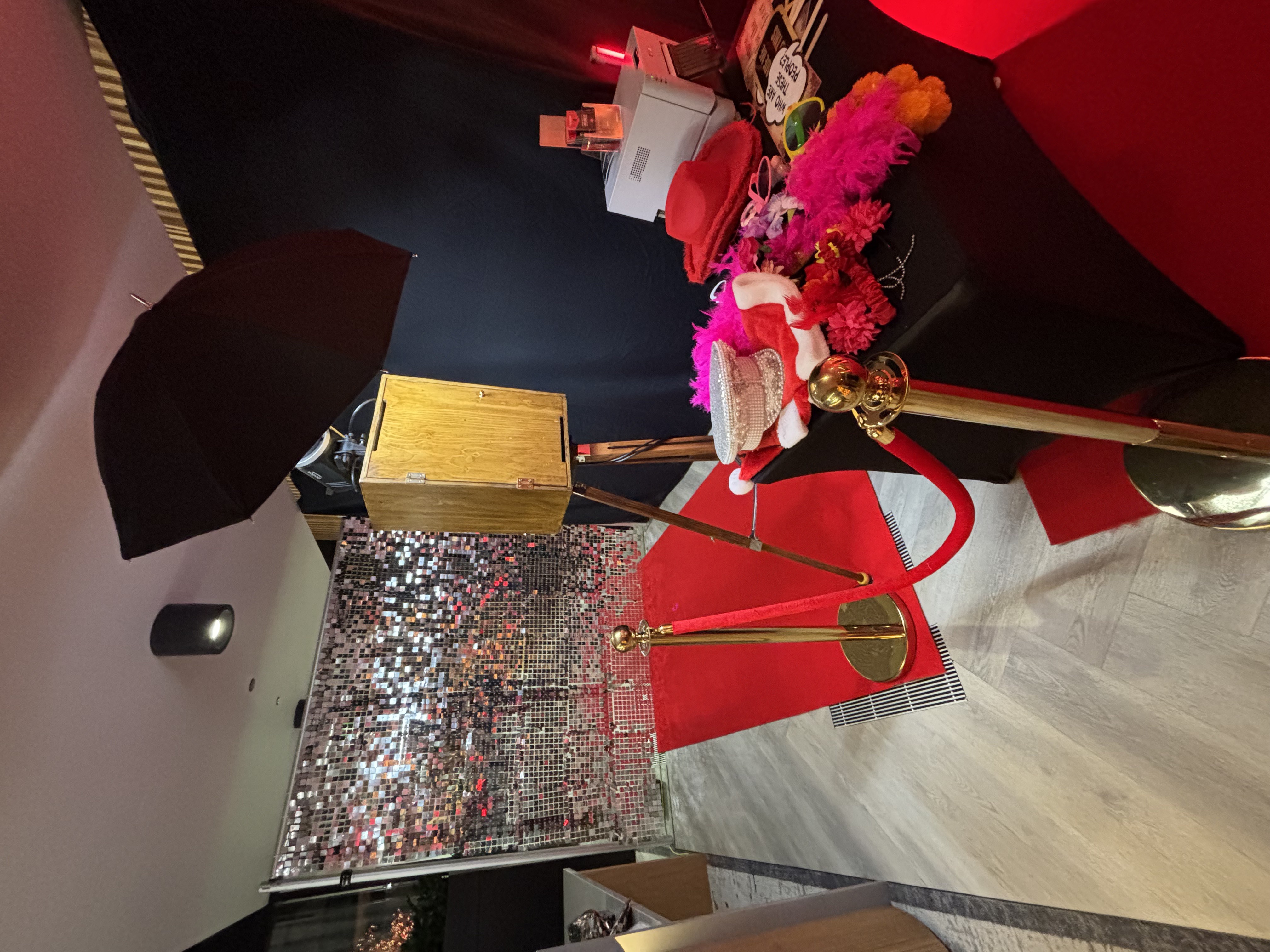 Glam booth with festive Christmas backdrop at corporate party