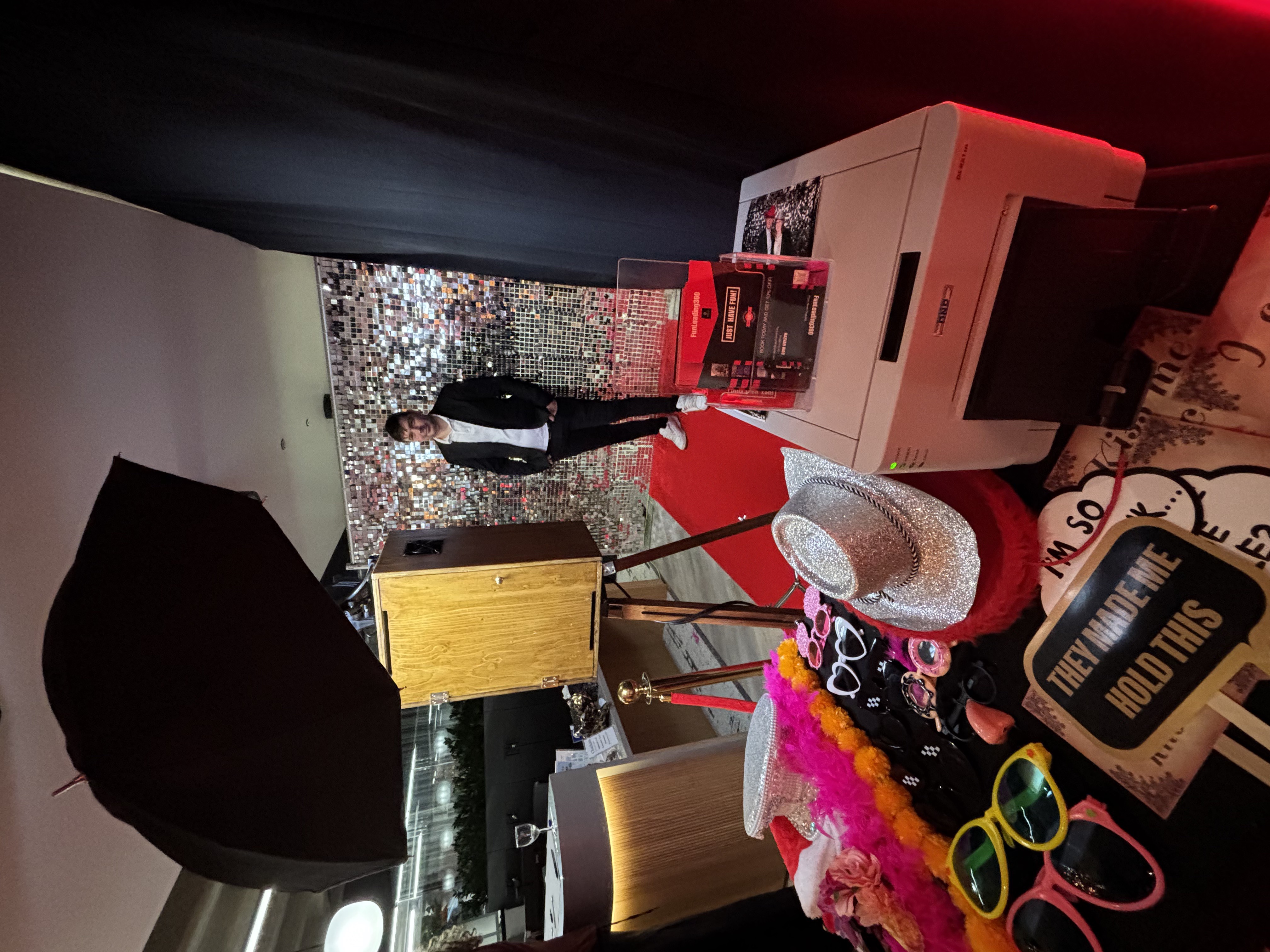Selfie pod with festive Christmas props at a corporate party